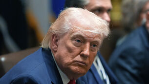 President Donald Trump listens during a Cabinet meeting at the White House (Alex Brandon/AP)