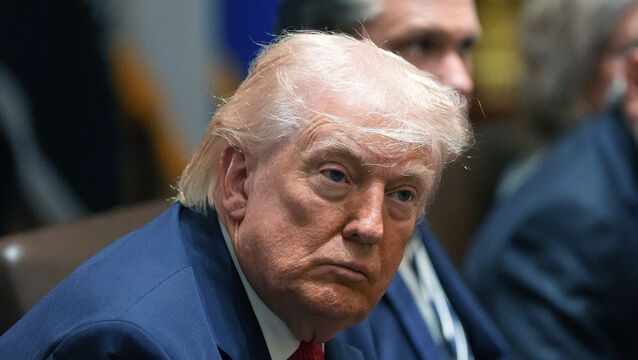 President Donald Trump listens during a Cabinet meeting at the White House (Alex Brandon/AP)