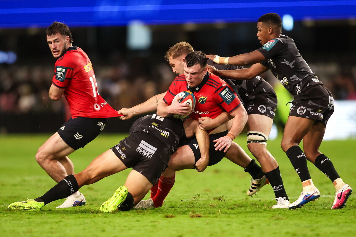 SWALLOWED: Tom Farrell is tackled by Andre Esterhuizen and Jannes Potgieter of Hollywoodbets Sharks during their Durban mauling. Pic: Shaun Roy/Sportsfile