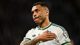 <p>Josh Magennis gestures toward the Northern Ireland supporters after his side's defeat to Italy. Pic: Ben McShane/Sportsfile</p>