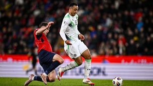 <p>Robin Hranáč goes to tackle Adam Idah. Pic: Seb Daly/Sportsfile</p>