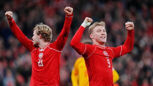 <p>GREAT DANES: Denmark's Morten Hjulmand, left, and Rasmus Hojlund celebrate an emphatic win. Pic: Liselotte Sabroe and Ritzau Scanpix/AP</p>