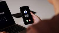 Scam Alert Notification on Smartphone Screen During Incoming Call