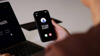 iStock-2218507020.jpg Scam Alert Notification on Smartphone Screen During Incoming Call