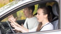 Young frightened driver woman and a man