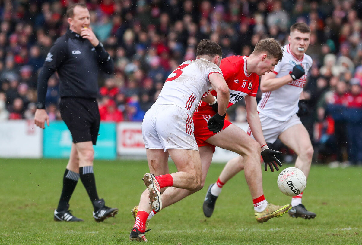 GRAPPLE: O'Mahony attempts to tackle Derry's Sean Young in a league game. Pic: Lorcan Doherty/Inpho