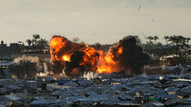 Smoke and flames rise from an Israeli military strike on a target next to a tent camp in Deir al-Balah, central Gaza (Abdel Kareem Hana/AP)