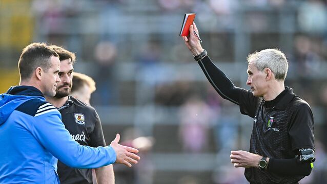 <p>SEEING RED: Referee Fergal Kelly shows the red card to Dublin manager Ger Brennan and to Galway strength and conditioning coach Cian Breathnach McGinn at Pearse Stadium. Pic: Piaras Ó Mídheach/Sportsfile</p>