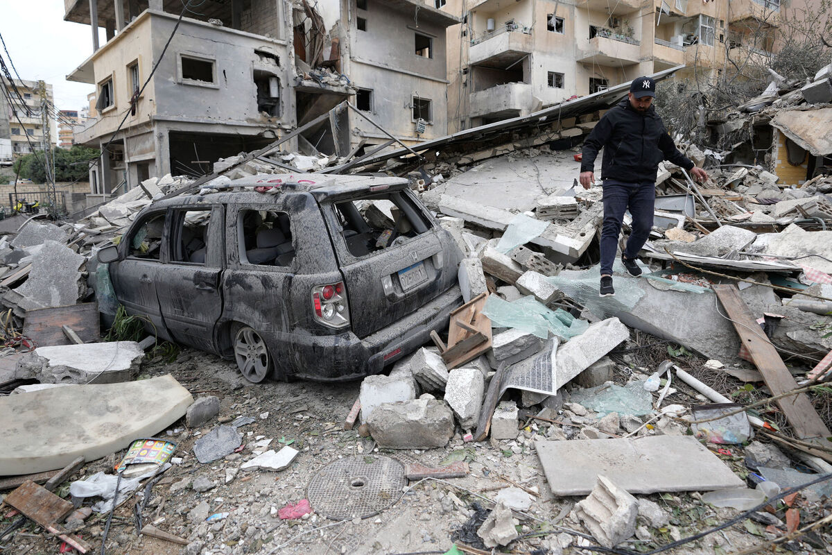 A man walks on the rubble of a destroyed building that was hit in an Israeli airstrike in the southern port city of Tyre in Lebanon on Thursday. Photo: AP/Hussein Malla A man walks on the rubble of a destroyed building that was hit in an Israeli airstrike in the southern port city of Tyre in Lebanon on Thursday. Photo: AP/Hussein Malla