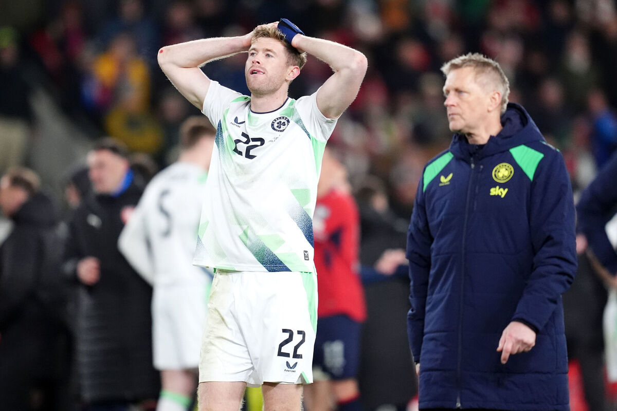 HEAVY HEARTS: Nathan Collins (left) and head coach Heimir Hallgrimsson appear dejected following defeat in a Prague. Pic: Adam Davy/PA HEAVY HEARTS: Nathan Collins (left) and head coach Heimir Hallgrimsson appear dejected following defeat in a Prague. Pic: Adam Davy/PA