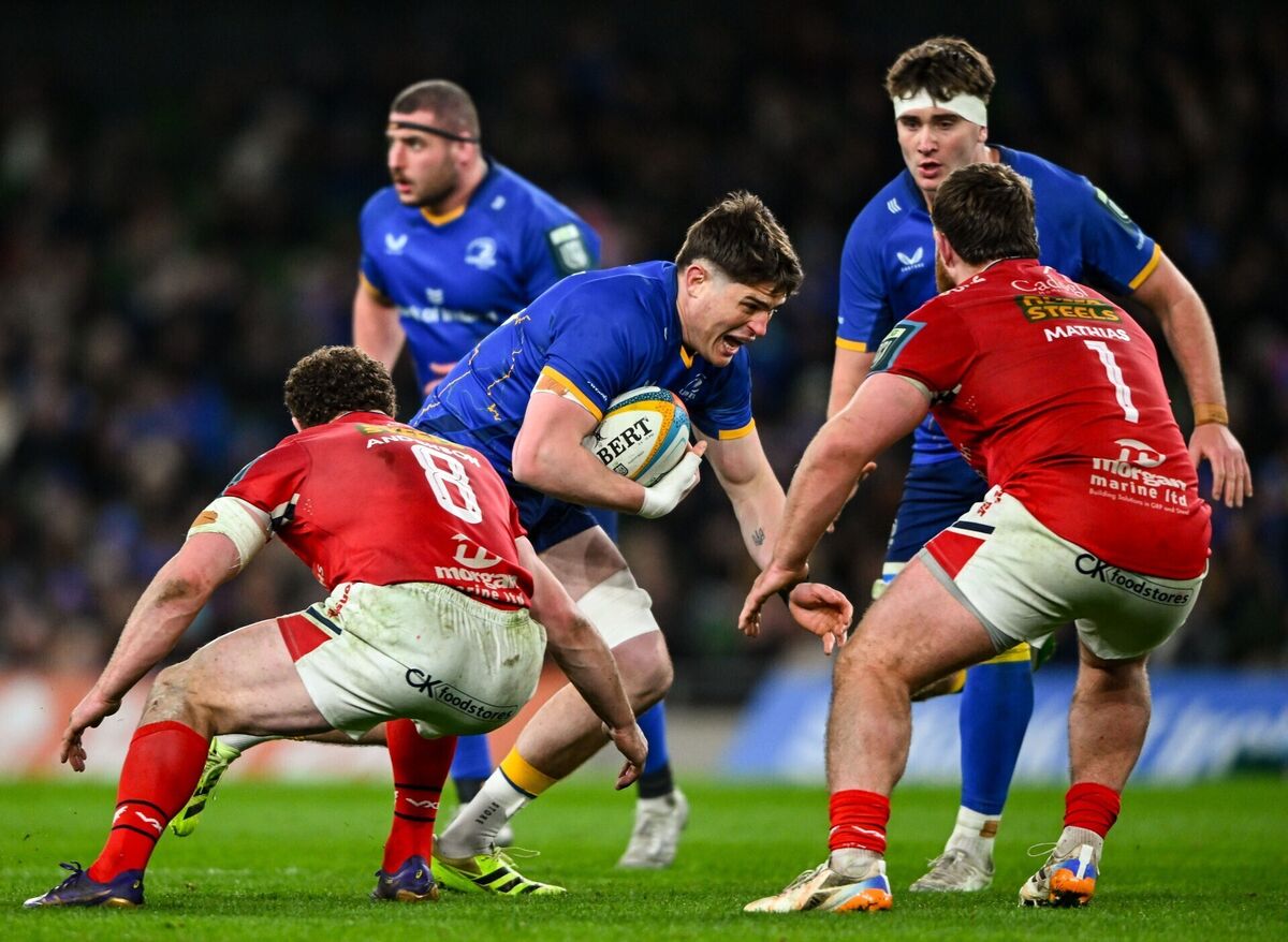 Alex Soroka is tackled by Scarlets players Fletcher Anderson, left, and Kemsley Mathias. Pic: Shauna Clinton/Sportsfile Alex Soroka is tackled by Scarlets players Fletcher Anderson, left, and Kemsley Mathias. Pic: Shauna Clinton/Sportsfile