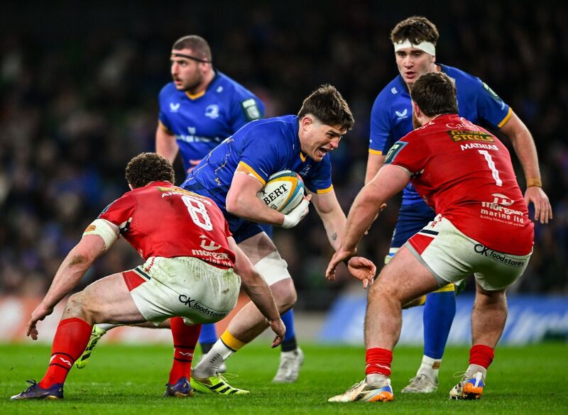 Alex Soroka is tackled by Scarlets players Fletcher Anderson, left, and Kemsley Mathias. Pic: Shauna Clinton/Sportsfile Alex Soroka is tackled by Scarlets players Fletcher Anderson, left, and Kemsley Mathias. Pic: Shauna Clinton/Sportsfile