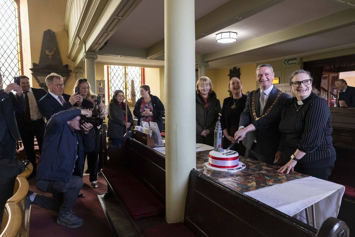Lord Mayor of Cork Fergal Dennehy and Reverend Meghan Farr cutting a cake made by a member of the congregation at St Anne's Shandon. Picture: Clare Keogh 