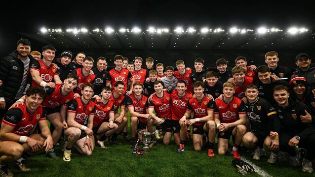 <p>Down players celebrate with the cup. Pic: David Fitzgerald/Sportsfile</p>