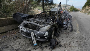 <p>A policeman checks the charred car that was carrying Hezbollah’s al-Manar TV correspondent Ali Shoeib. Picture: Mohammed Zaatari/AP</p> <p>A policeman checks the charred car that was carrying Hezbollah’s al-Manar TV correspondent Ali Shoeib. Picture: Mohammed Zaatari/AP</p>