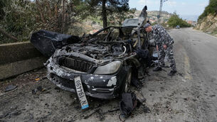 <p>A policeman checks the charred car that was carrying Hezbollah’s al-Manar TV correspondent Ali Shoeib. Picture: Mohammed Zaatari/AP</p> <p>A policeman checks the charred car that was carrying Hezbollah’s al-Manar TV correspondent Ali Shoeib. Picture: Mohammed Zaatari/AP</p>