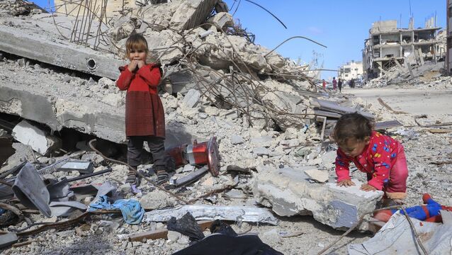 <p>Children play in the rubble of a destroyed building in Rafah, southern Gaza Strip, Monday, Jan. 20, 2025. (AP Photo/Mariam Dagga)</p>