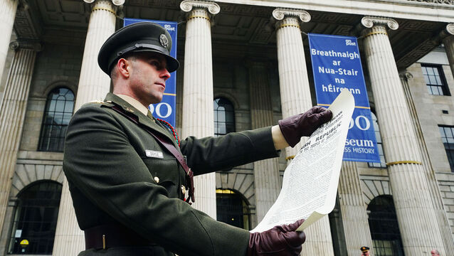 <p>Captain Austin Doyle with the Proclamation of Independence following a ceremony at the GPO on O’Connell St in Dublin to mark the anniversary of the 1916 Easter Rising in 2023. <span class="contextmenu emphasis CaptionCredit">Picture: Brian Lawless/ PA</span>
            </p>