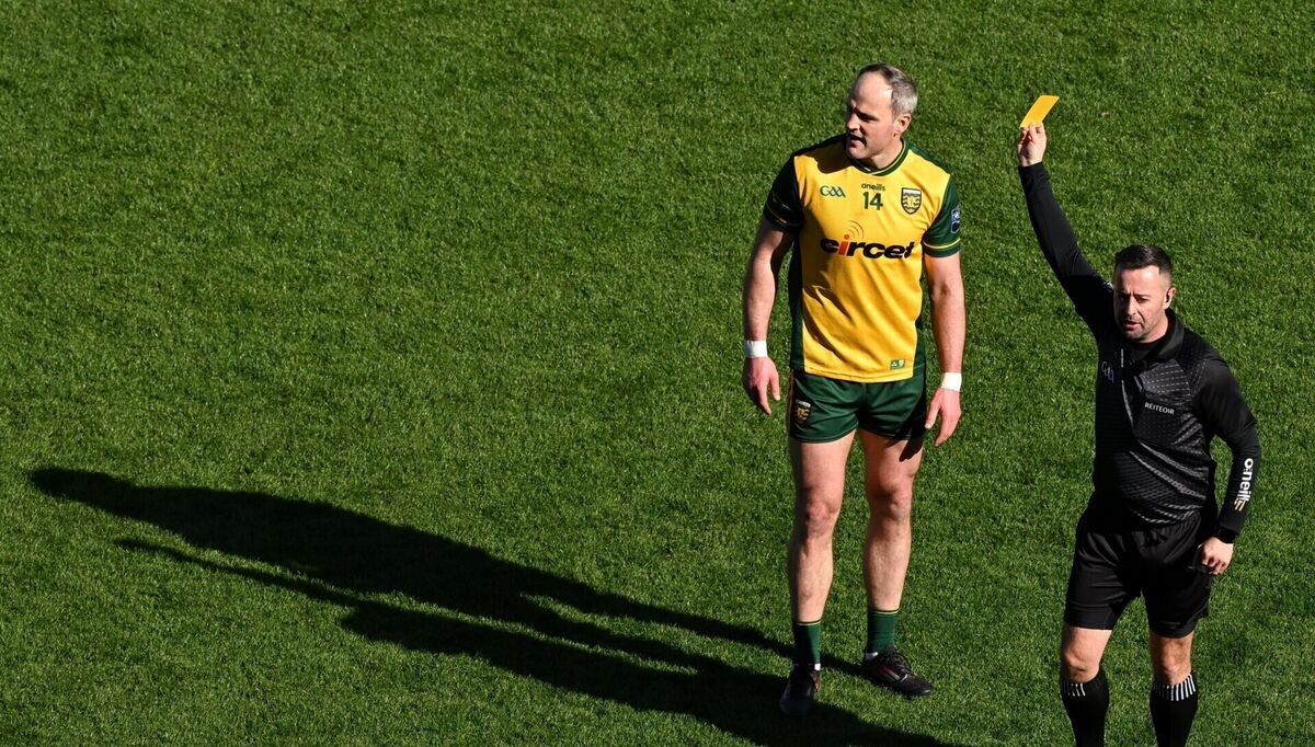Michael Murphy of Donegal is shown a yellow card by referee David Gough. Pic: Ramsey Cardy/Sportsfile
