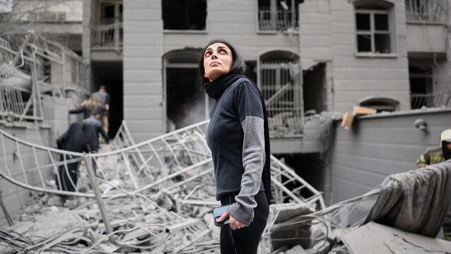 <p>A woman looks up at the site of a strike that hit a residential building amid the US-Israeli military campaign in Tehran, Iran. Picture: Sajjad Safari/AP</p>