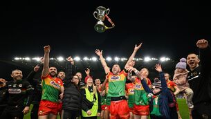 <p>Carlow players and staff celebrate with the cup after the Allianz Football League Division 4 final match between Carlow and Longford at Croke Park in Dublin. Pic: David Fitzgerald/Sportsfile</p>