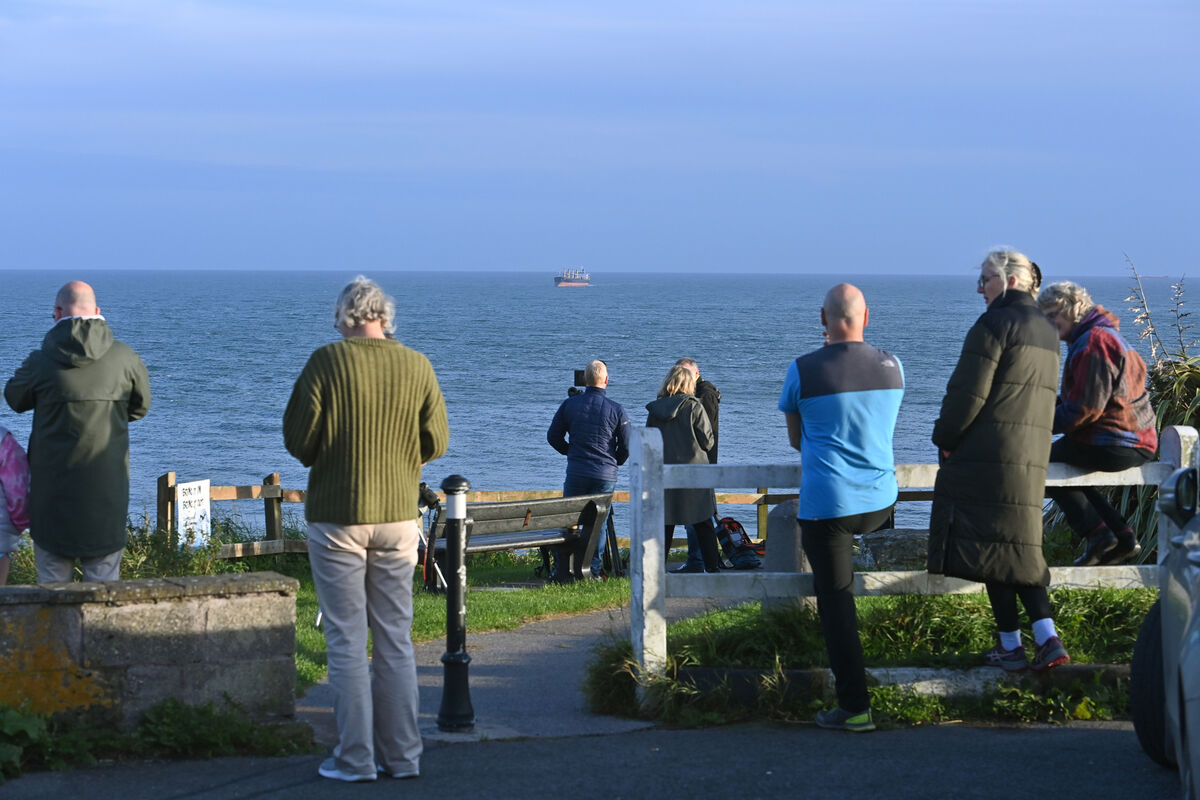 People at Roches Point watch the MV Matthew being escorted into Cork Harbour in September 2023 after it was boarded by a joint task force including gardaí and army and navy personnel. The ship was found to contain cocaine worth €157m. Picture: Dan Linehan