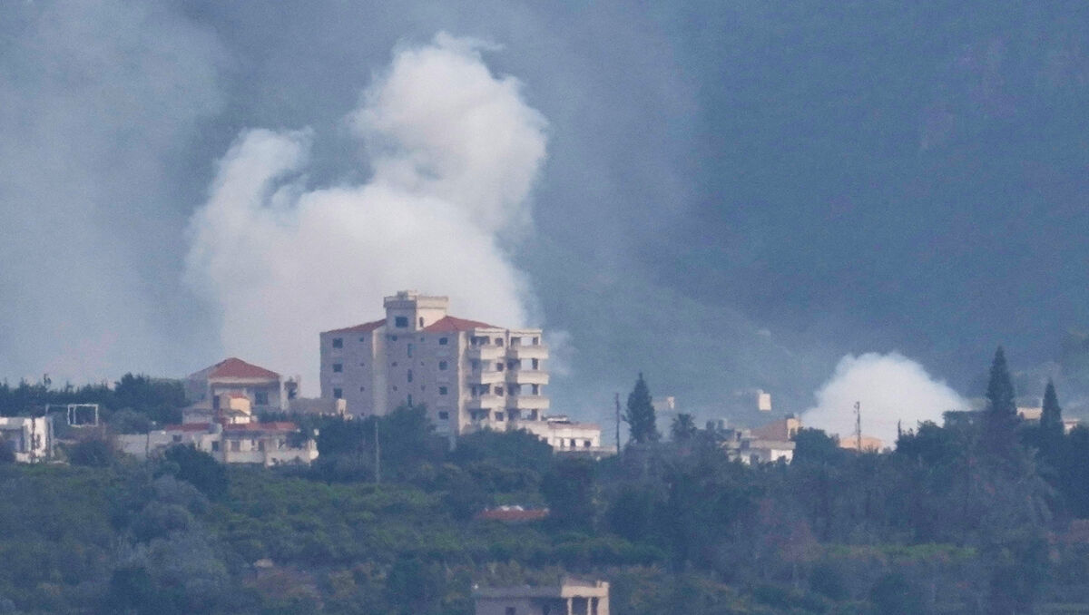 Smoke rises from Israeli artillery shelling on the village of Qlaileh, as it is seen from the city of Tyre, south Lebanon, Saturday, March 28, 2026. (AP Photo/Hussein Malla)