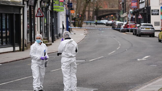 <p>Forensic investigators at the scene in Friar Gate, Derby (Jacob King/PA)</p>