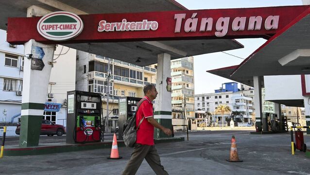 <p>A man walks past an empty gas station in Havana on February 19, 2026. Faced with a severe energy crisis exacerbated by US sanctions, private companies in Cuba are attempting to import fuel after the island's government agreed to end its monopoly on the sector. (Photo by YAMIL LAGE / AFP via Getty Images)</p>