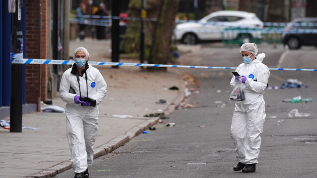 <p>Forensic investigators at the scene in Friar Gate, Derby (Jacob King/PA)</p>