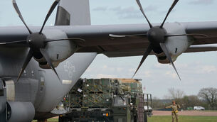 <p>Munitions are unloaded from a cargo plane in England last week. Picture: Alastair Grant/AP</p> <p>Munitions are unloaded from a cargo plane in England last week. Picture: Alastair Grant/AP</p>