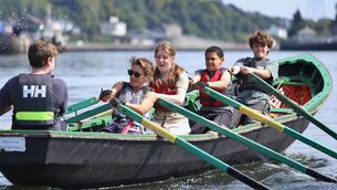 <p>Finn Paterson (far right) rows with Meitheal Mara on the River Lee. He had zero rowing experience when he went to his first summer camp in 2024.</p>