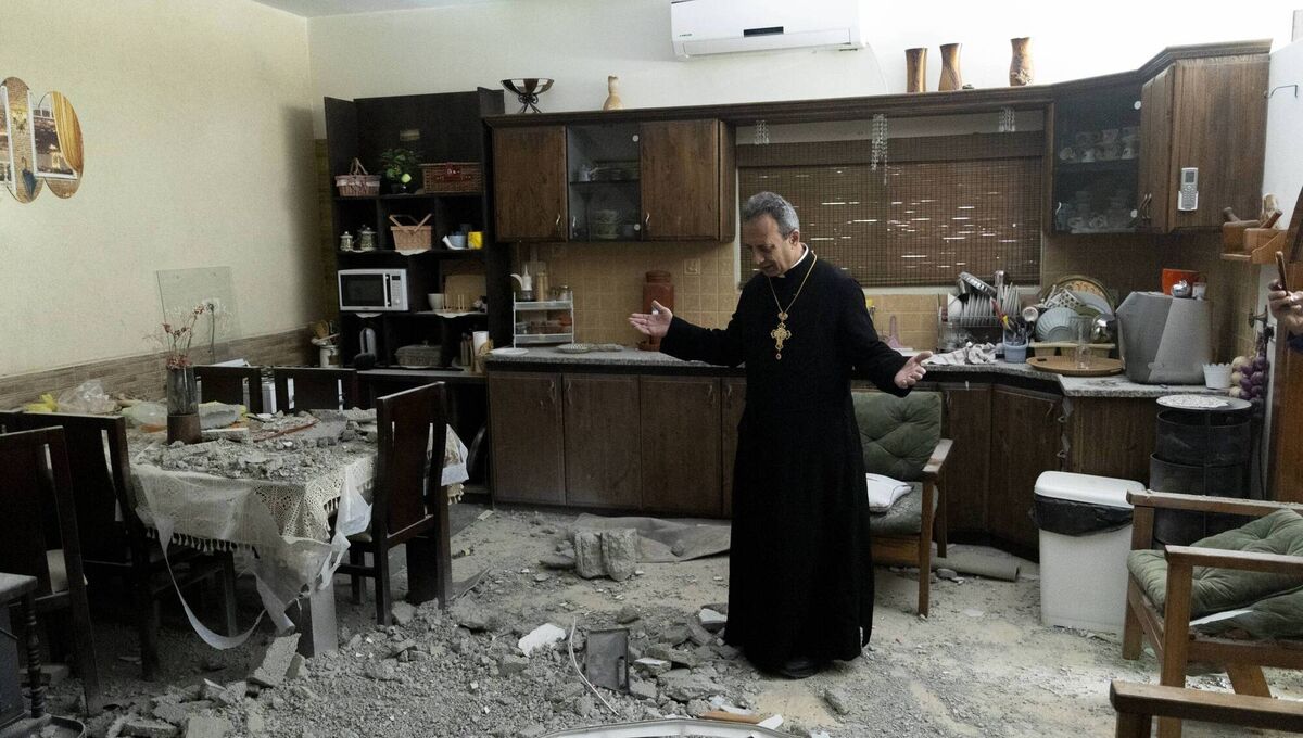 A priest inspects the impact of a house that was hit by part of a ballistic missile launched from Iran on March 30, 2026, in Shefaram, Israel. Iran has continued firing waves of drones and missiles at Israel after the United States and Israel launched a joint attack on Iran early on February 28. Picture: Amir Levy/Getty A priest inspects the impact of a house that was hit by part of a ballistic missile launched from Iran on March 30, 2026, in Shefaram, Israel. Iran has continued firing waves of drones and missiles at Israel after the United States and Israel launched a joint attack on Iran early on February 28. Picture: Amir Levy/Getty