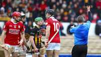 Thomas Walsh shows Kilkenny's Ivan Bolger a black card 1/3/2026