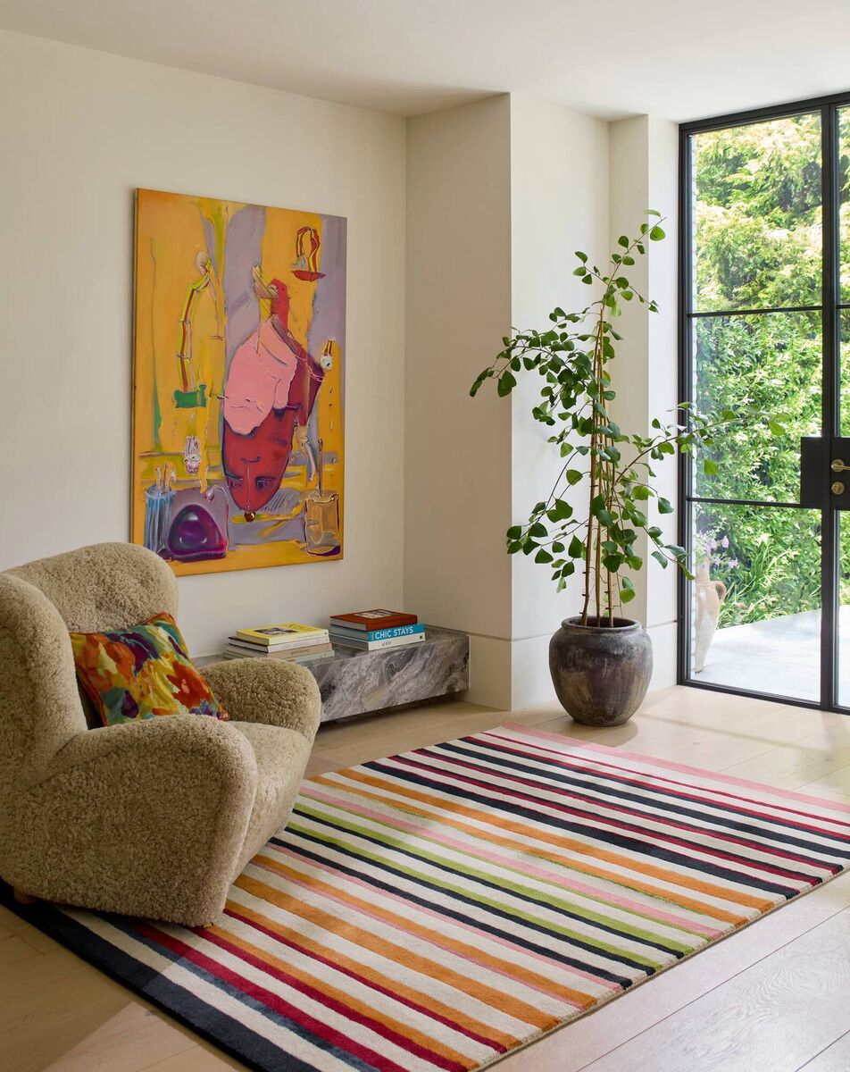 The Harlequin Calla Pomegranate/Clementine handtufted rug, priced from €699 for the 140cmx200cm size; Rugs.ie. 