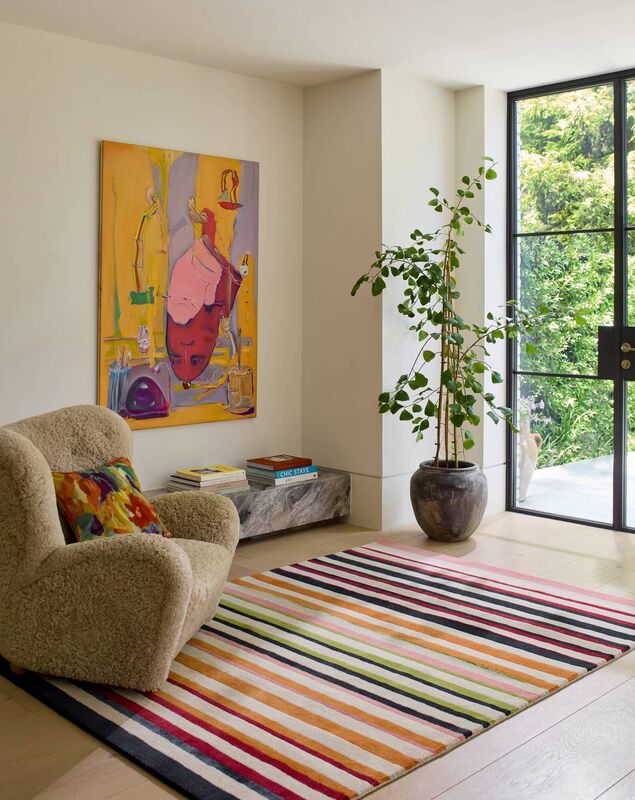 The Harlequin Calla Pomegranate/Clementine handtufted rug, priced from €699 for the 140cmx200cm size; Rugs.ie. 