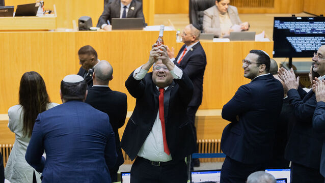<p>Israel's national security, Itamar Ben-Gvir, center, and lawmakers celebrate after Israel's parliament passed a law approving the death penalty for Palestinians convicted of murdering Israelis, at the Knesset in Jerusalem Monday, March 30, 2026. (AP Photo/Itay Cohen)</p>