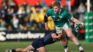 <p>Ireland's Rob Carney is tackled against Scotland. Pic: Ben Brady/Inpho</p>