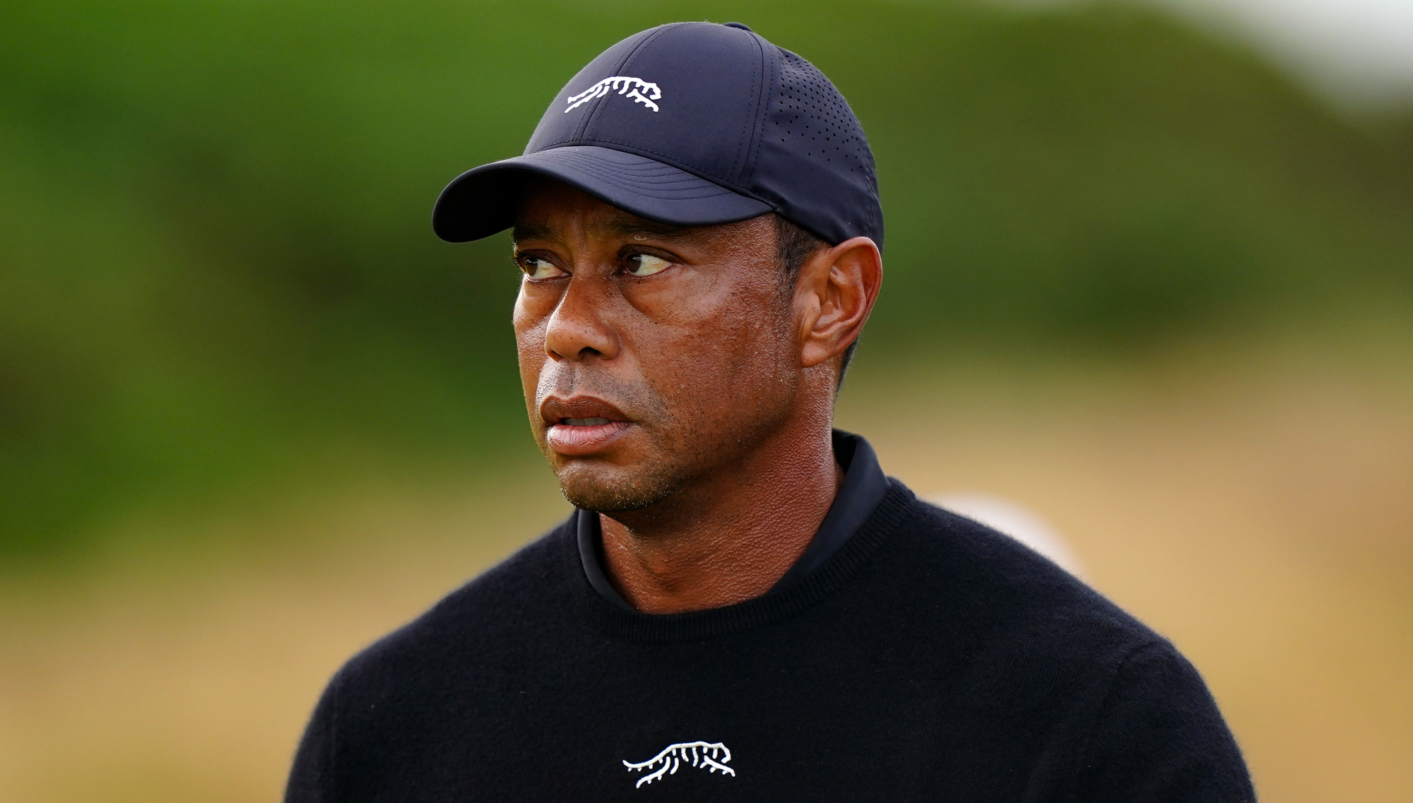 Tiger Woods says looking at his phone led to Florida rollover crash