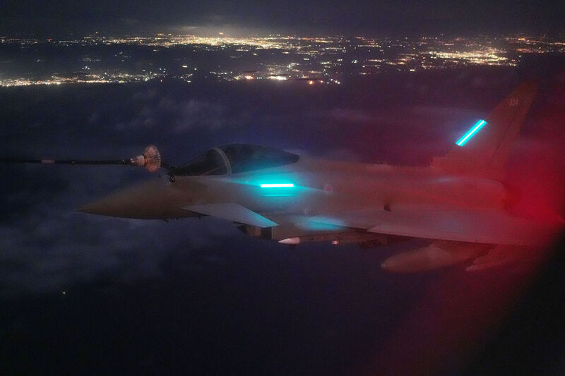 RAF Typhoon FGR4 refuels at night from a Voyager Air-to-Air Refuelling (AAR) aircraft over water between Cyprus and Israel. The UK has been deploying additional defensive capabilities to Cyprus since January, including radar systems, counter-drone systems, F-35 jets, ground-based air defence, and 500 extra air defence personnel Picture;  Jonathan Brady/PA Wire