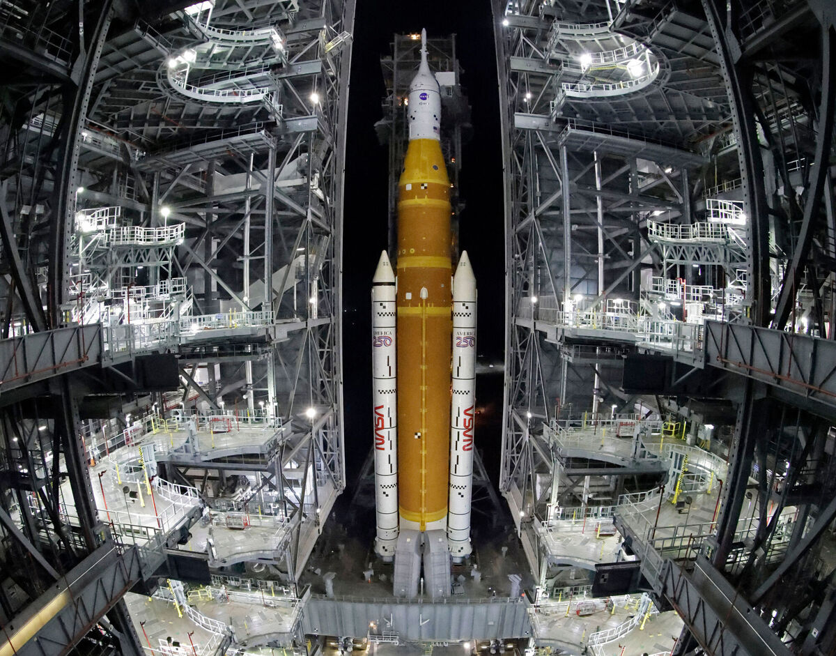 The NASA Artemis II rocket with the Orion spacecraft aboard leaves the Vehicle Assembly Building moving slowly to pad 39B at the Kennedy Space Center in Cape Canaveral, Fla., Friday, March 20, 2026. (AP Photo/Terry Renna)