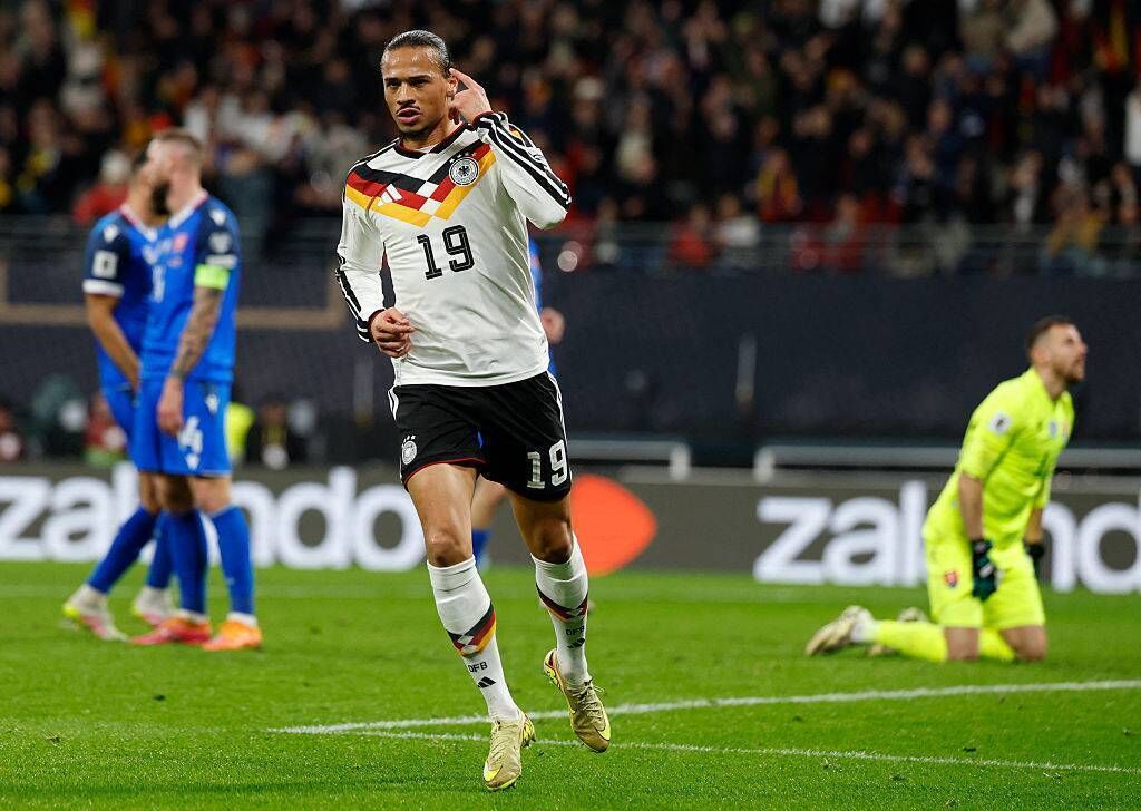 Leroy Sané (top) scores Germany’s fourth goal in the 6-0 win over Slovakia which secured their place at the World Cup. Pic: Odd Andersen/AFP/Getty
