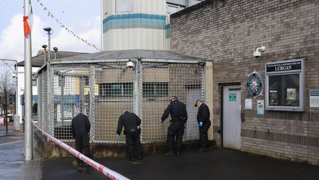 <p>PSNI officers from the Tactical Support Group (TSG) search outside the police station in Lurgan, Co Armagh after a delivery driver was threatened at gunpoint and forced to drive his car with an object inside to the town's police station, sparking a security alert. Picture: Liam McBurney/PA Wire</p>