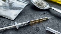 drug syringe and cooked heroin on spoon. drug addict problem and therapy concept