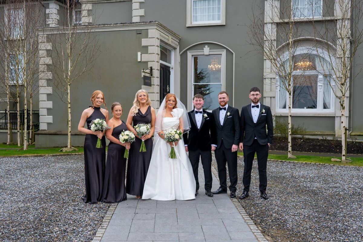 Anna Bell and Bryan Kehoe with their wedding party. Anna Bell and Bryan Kehoe with their wedding party.