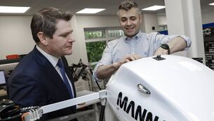 <p>Paul Connolly, right, head of hardware engineering, Manna Air Delivery, gives a guided tour of the manufacturing workshop to enterprise minister Peter Burke at the Dublin HQ of Manna Air Delivery on Wednesday. Pictures: Julien Behal</p>