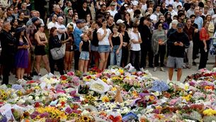 <p>Mourners gather by floral tributes at the Bondi Pavillion in memory of the victims of a shooting at Bondi Beach, in Sydney on December 15, 2025. Picture: Saeed KHAN / AFP via Getty Images.</p>
