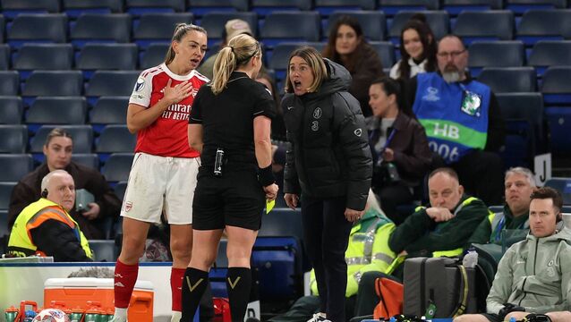 <p>Sonia Bompastor, manager of Chelsea, reacts after being shown a yellow card by referee Frida Mia Klarlund as Katie McCabe of Arsenal looks on. Pic: Warren Little/Getty Images</p>