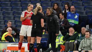 <p>Sonia Bompastor, manager of Chelsea, reacts after being shown a yellow card by referee Frida Mia Klarlund as Katie McCabe of Arsenal looks on. Pic: Warren Little/Getty Images</p>