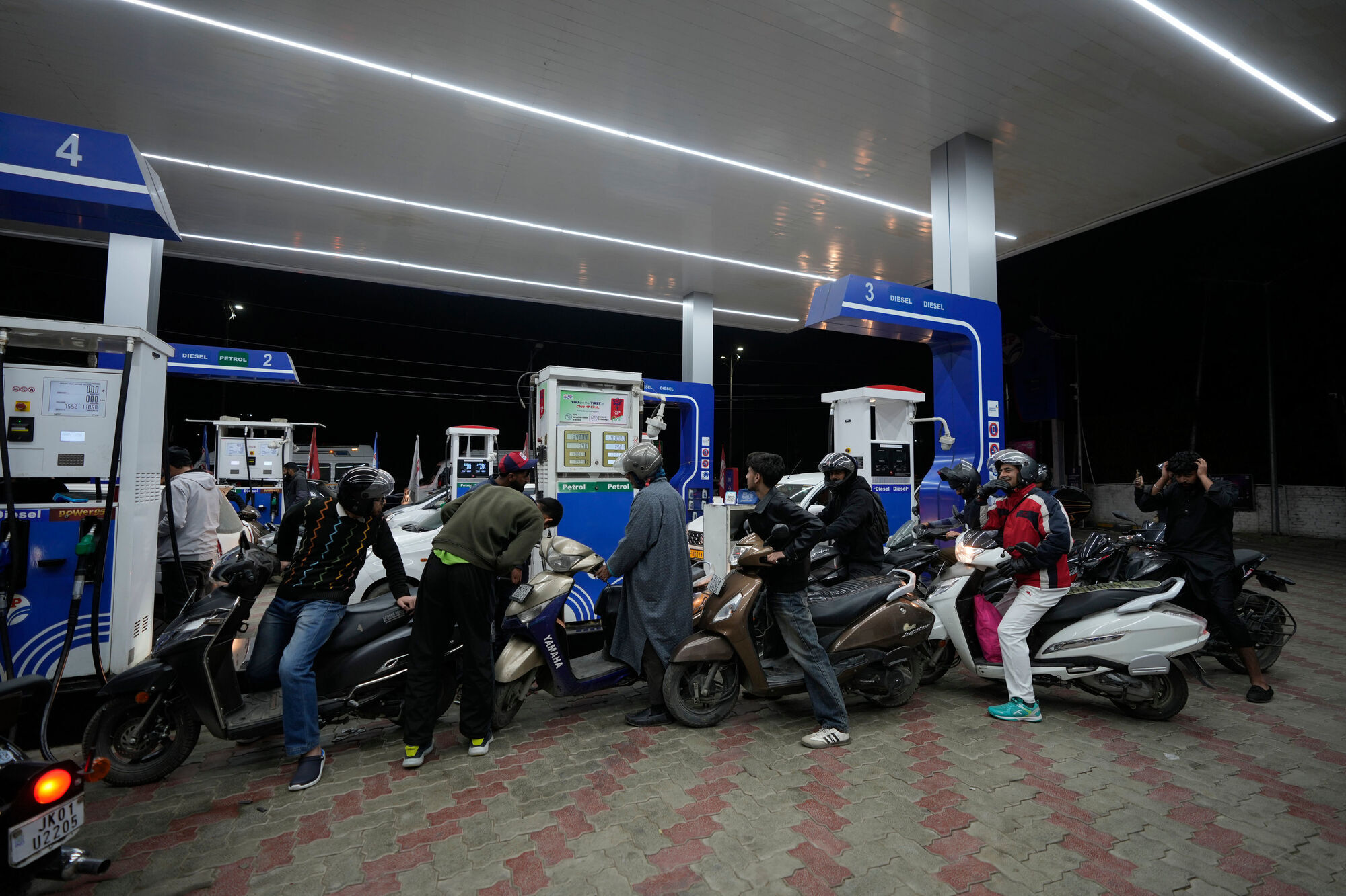 Drive slower, work from home and ditch the tie: the world responds to Iran war fuel crisis